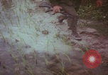 Image of Vietnamese villagers with US soldiers Vietnam, 1967, second 18 stock footage video 65675079546