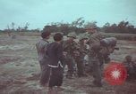 Image of Vietnamese villagers with US soldiers Vietnam, 1967, second 21 stock footage video 65675079546