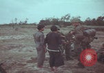 Image of Vietnamese villagers with US soldiers Vietnam, 1967, second 22 stock footage video 65675079546