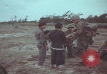 Image of Vietnamese villagers with US soldiers Vietnam, 1967, second 26 stock footage video 65675079546