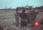 Image of Vietnamese villagers with US soldiers Vietnam, 1967, second 27 stock footage video 65675079546