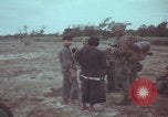Image of Vietnamese villagers with US soldiers Vietnam, 1967, second 28 stock footage video 65675079546