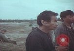 Image of Vietnamese villagers with US soldiers Vietnam, 1967, second 29 stock footage video 65675079546