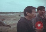 Image of Vietnamese villagers with US soldiers Vietnam, 1967, second 30 stock footage video 65675079546