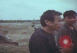 Image of Vietnamese villagers with US soldiers Vietnam, 1967, second 31 stock footage video 65675079546