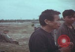 Image of Vietnamese villagers with US soldiers Vietnam, 1967, second 32 stock footage video 65675079546