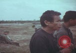 Image of Vietnamese villagers with US soldiers Vietnam, 1967, second 33 stock footage video 65675079546