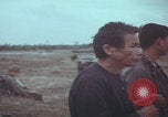 Image of Vietnamese villagers with US soldiers Vietnam, 1967, second 34 stock footage video 65675079546