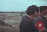 Image of Vietnamese villagers with US soldiers Vietnam, 1967, second 41 stock footage video 65675079546