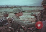 Image of Vietnamese villagers with US soldiers Vietnam, 1967, second 42 stock footage video 65675079546