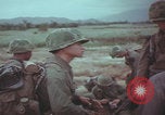 Image of Vietnamese villagers with US soldiers Vietnam, 1967, second 43 stock footage video 65675079546