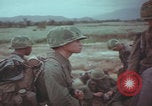 Image of Vietnamese villagers with US soldiers Vietnam, 1967, second 44 stock footage video 65675079546