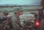 Image of Vietnamese villagers with US soldiers Vietnam, 1967, second 45 stock footage video 65675079546