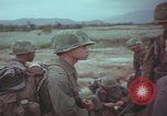 Image of Vietnamese villagers with US soldiers Vietnam, 1967, second 46 stock footage video 65675079546