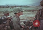 Image of Vietnamese villagers with US soldiers Vietnam, 1967, second 47 stock footage video 65675079546