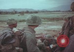 Image of Vietnamese villagers with US soldiers Vietnam, 1967, second 48 stock footage video 65675079546