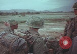 Image of Vietnamese villagers with US soldiers Vietnam, 1967, second 49 stock footage video 65675079546