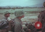 Image of Vietnamese villagers with US soldiers Vietnam, 1967, second 50 stock footage video 65675079546