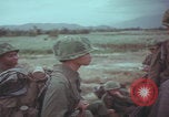 Image of Vietnamese villagers with US soldiers Vietnam, 1967, second 51 stock footage video 65675079546