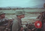 Image of Vietnamese villagers with US soldiers Vietnam, 1967, second 52 stock footage video 65675079546