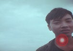 Image of Vietnamese villagers with US soldiers Vietnam, 1967, second 53 stock footage video 65675079546