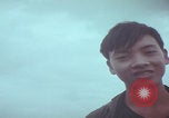 Image of Vietnamese villagers with US soldiers Vietnam, 1967, second 54 stock footage video 65675079546