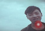 Image of Vietnamese villagers with US soldiers Vietnam, 1967, second 58 stock footage video 65675079546