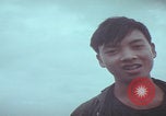 Image of Vietnamese villagers with US soldiers Vietnam, 1967, second 60 stock footage video 65675079546
