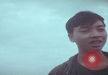 Image of Vietnamese villagers with US soldiers Vietnam, 1967, second 62 stock footage video 65675079546