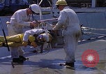 Image of NASA men fixing peroxide-powered EVA backpack Hampton Virginia USA, 1968, second 9 stock footage video 65675079600