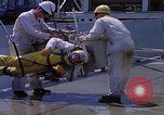 Image of NASA men fixing peroxide-powered EVA backpack Hampton Virginia USA, 1968, second 12 stock footage video 65675079600