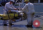 Image of NASA men fixing peroxide-powered EVA backpack Hampton Virginia USA, 1968, second 16 stock footage video 65675079600