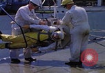 Image of NASA men fixing peroxide-powered EVA backpack Hampton Virginia USA, 1968, second 17 stock footage video 65675079600
