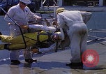 Image of NASA men fixing peroxide-powered EVA backpack Hampton Virginia USA, 1968, second 19 stock footage video 65675079600