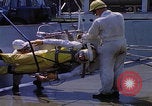 Image of NASA men fixing peroxide-powered EVA backpack Hampton Virginia USA, 1968, second 26 stock footage video 65675079600