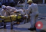 Image of NASA men fixing peroxide-powered EVA backpack Hampton Virginia USA, 1968, second 27 stock footage video 65675079600