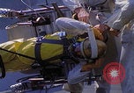 Image of NASA men fixing peroxide-powered EVA backpack Hampton Virginia USA, 1968, second 41 stock footage video 65675079600