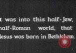 Image of mother wraps baby in swaddle Bethlehem Palestine, 1941, second 3 stock footage video 65675079605
