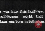 Image of mother wraps baby in swaddle Bethlehem Palestine, 1941, second 4 stock footage video 65675079605