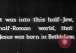 Image of mother wraps baby in swaddle Bethlehem Palestine, 1941, second 5 stock footage video 65675079605