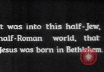 Image of mother wraps baby in swaddle Bethlehem Palestine, 1941, second 7 stock footage video 65675079605