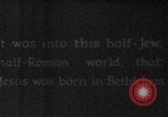Image of mother wraps baby in swaddle Bethlehem Palestine, 1941, second 11 stock footage video 65675079605