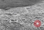 Image of mother wraps baby in swaddle Bethlehem Palestine, 1941, second 18 stock footage video 65675079605