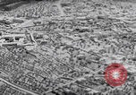 Image of mother wraps baby in swaddle Bethlehem Palestine, 1941, second 21 stock footage video 65675079605