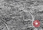 Image of mother wraps baby in swaddle Bethlehem Palestine, 1941, second 26 stock footage video 65675079605