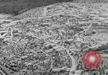 Image of mother wraps baby in swaddle Bethlehem Palestine, 1941, second 28 stock footage video 65675079605