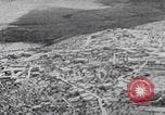 Image of mother wraps baby in swaddle Bethlehem Palestine, 1941, second 30 stock footage video 65675079605