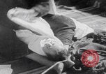 Image of mother wraps baby in swaddle Bethlehem Palestine, 1941, second 38 stock footage video 65675079605
