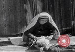 Image of mother wraps baby in swaddle Bethlehem Palestine, 1941, second 48 stock footage video 65675079605