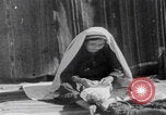 Image of mother wraps baby in swaddle Bethlehem Palestine, 1941, second 51 stock footage video 65675079605